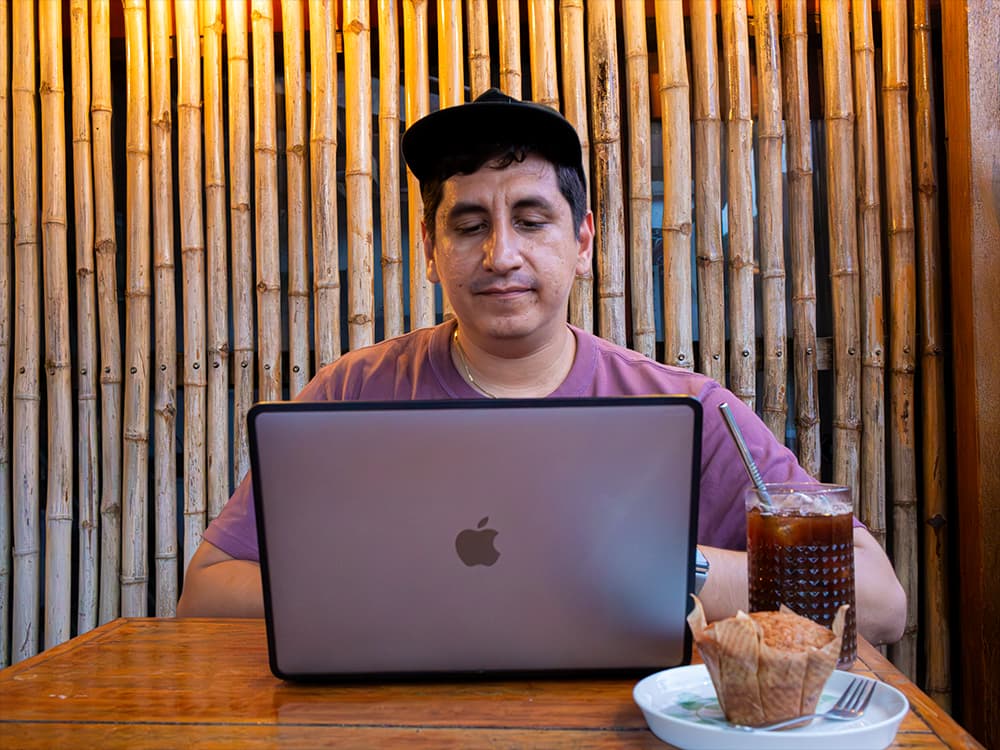 Los Angeles web developer Lindy Ramirez coding custom landing page at workspace