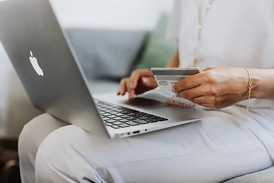 Los Angeles ecommerce entrepreneur managing successful Shopify store on laptop