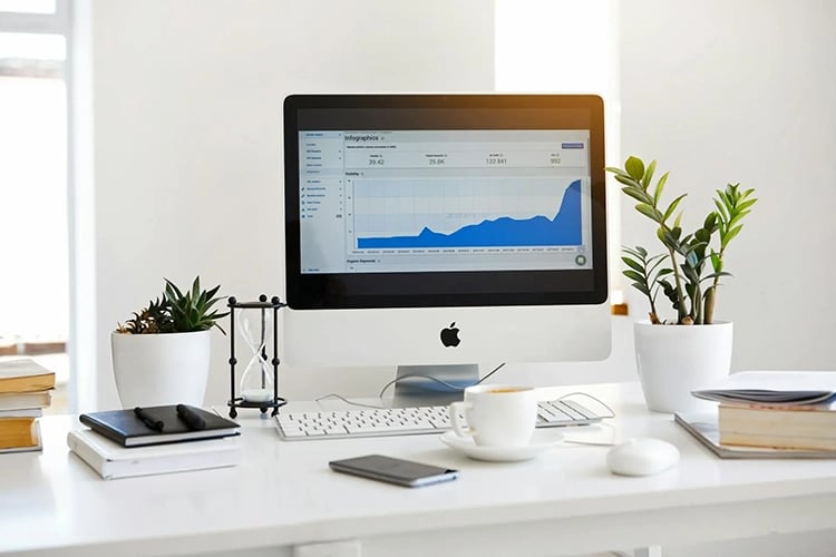 Modern Office With Monitor Displaying Web Analytics